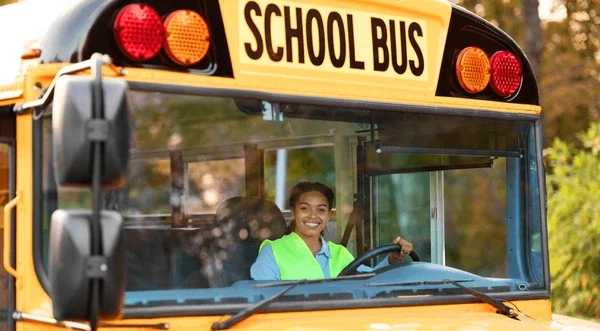 portrait happy black female driver 600nw 2364346953 e1728756676478